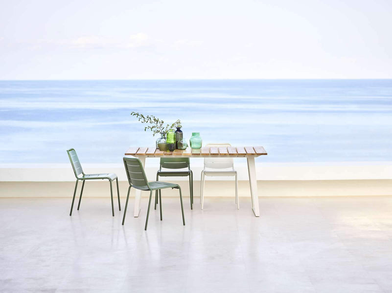 Copenhagen Dining Table w/ Extension by Cane-Line, showing dining table with chairs in live shot.