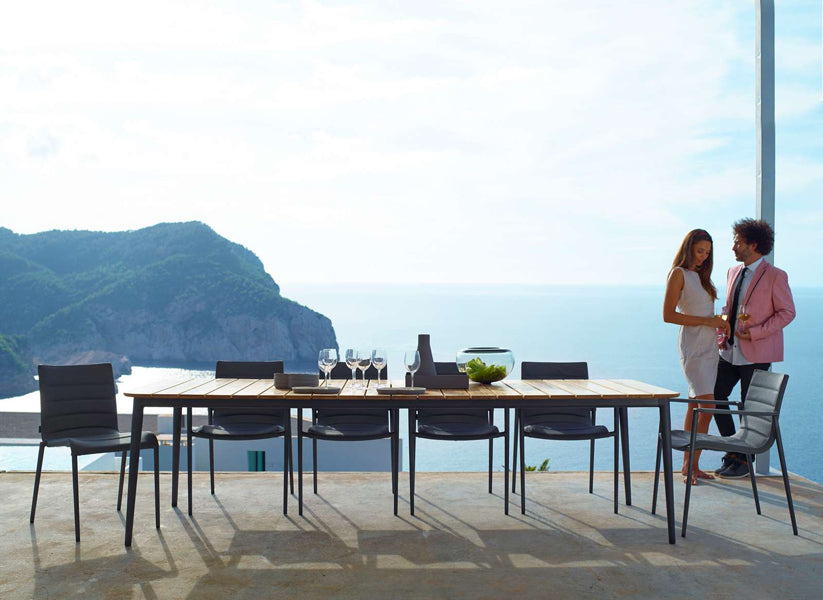 Core Dining Table by Cane-Line, showing core dining table with chairs in live shot.
