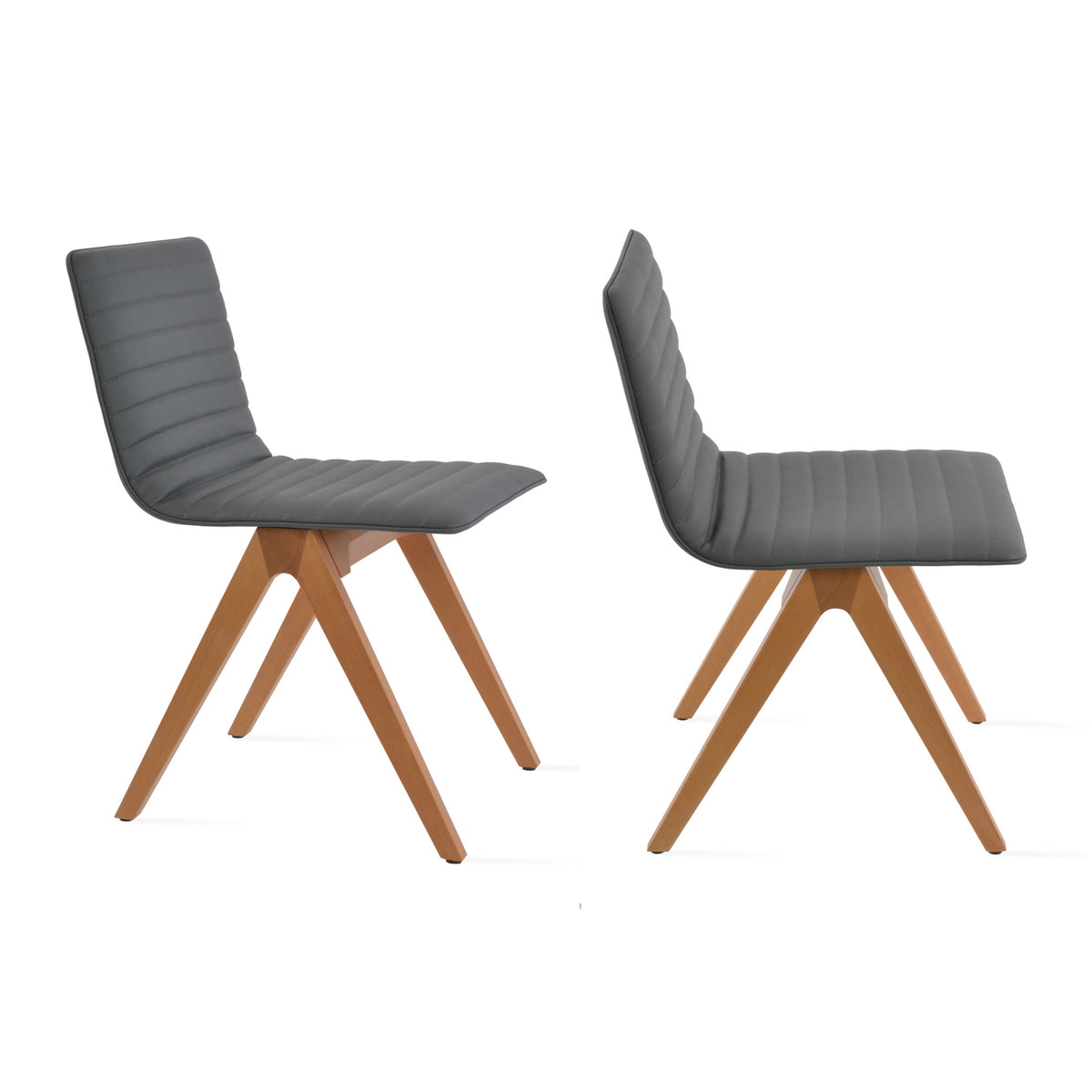 Corona Fino Full Upholstery Dining Chair by SohoConcept, showing angle view of two chairs in grey leatherette with natural finish.