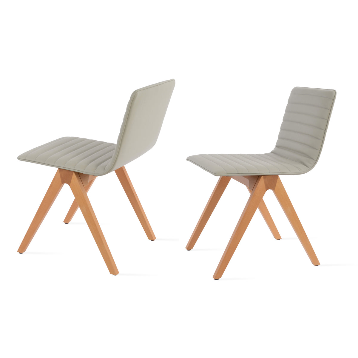 Corona Fino Full Upholstery Dining Chair by SohoConcept, showing angle view in light grey leatherette with natural finish.