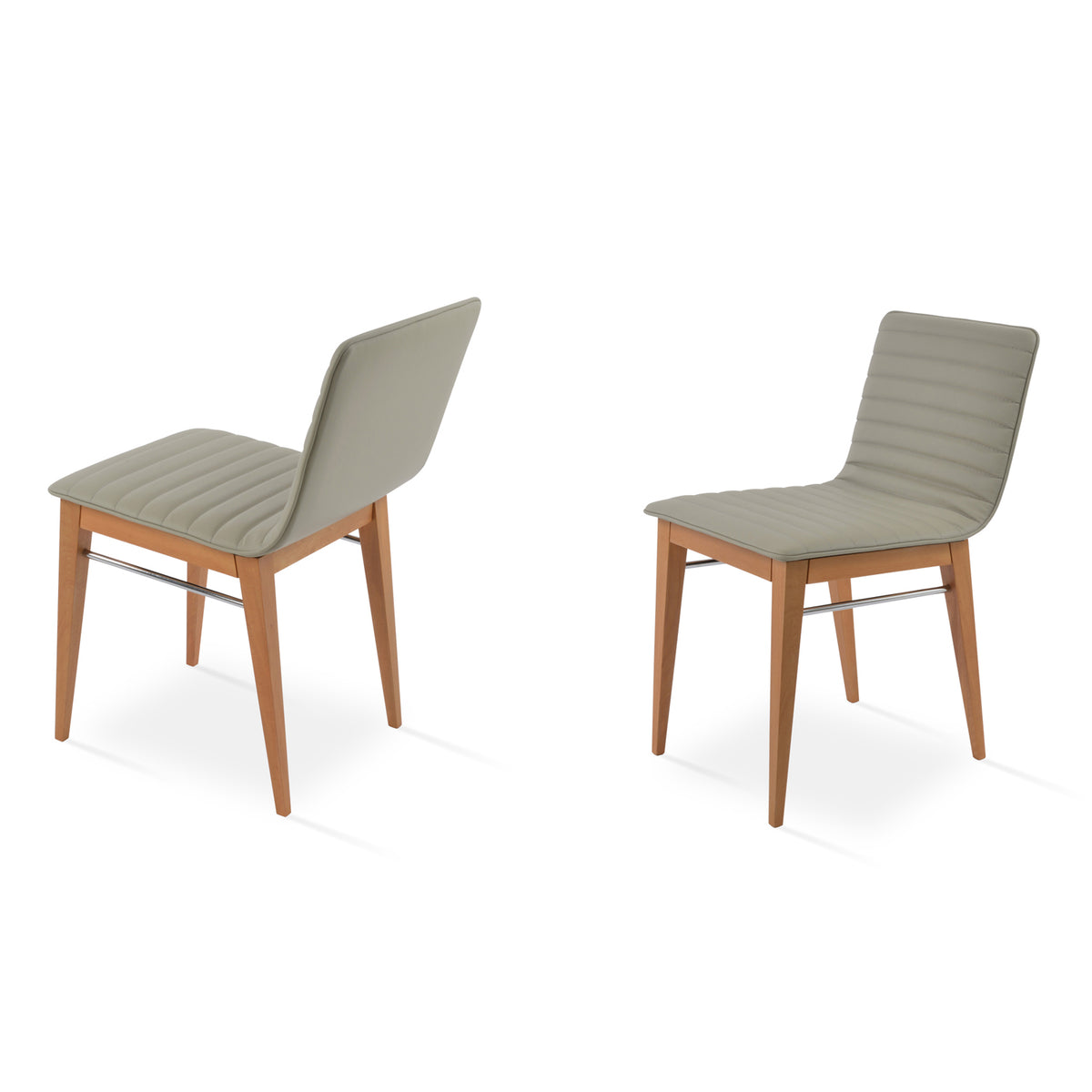 Corona Full Upholstery Wood Dining Chair by SohoConcept, showing angle view of two chairs in light grey leatherette with natural finish.