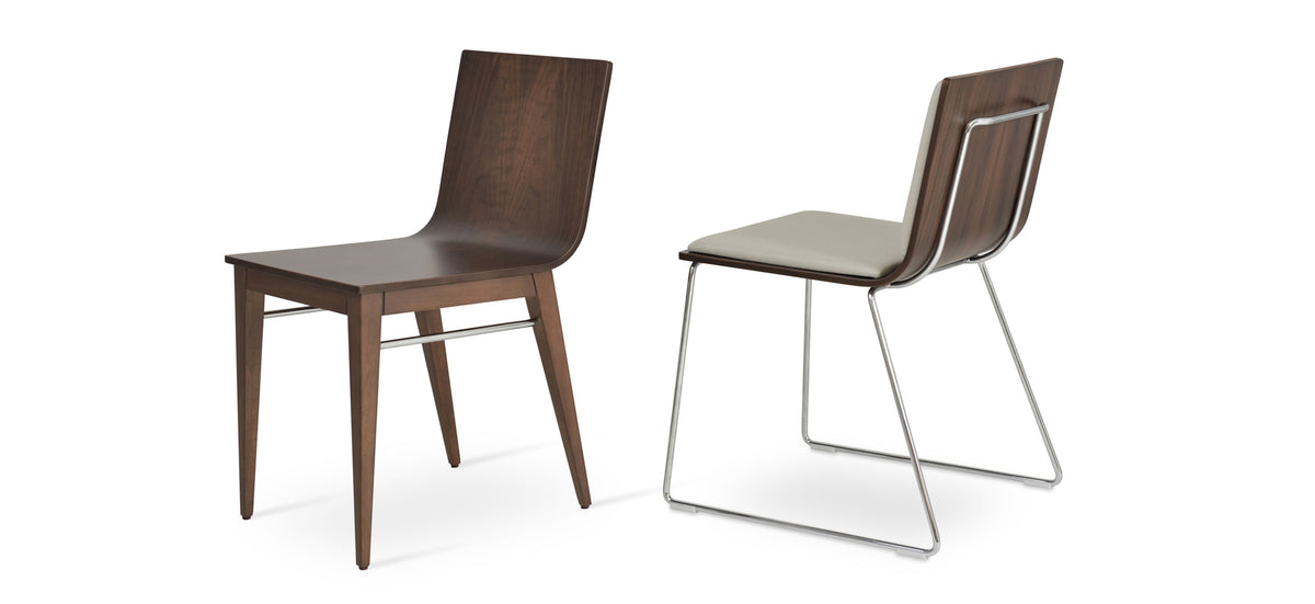 Corona Wood Dining Chair by SohoConcept, showing angle view in american walnut veneer base & light grey leatherette pad with handle back base.