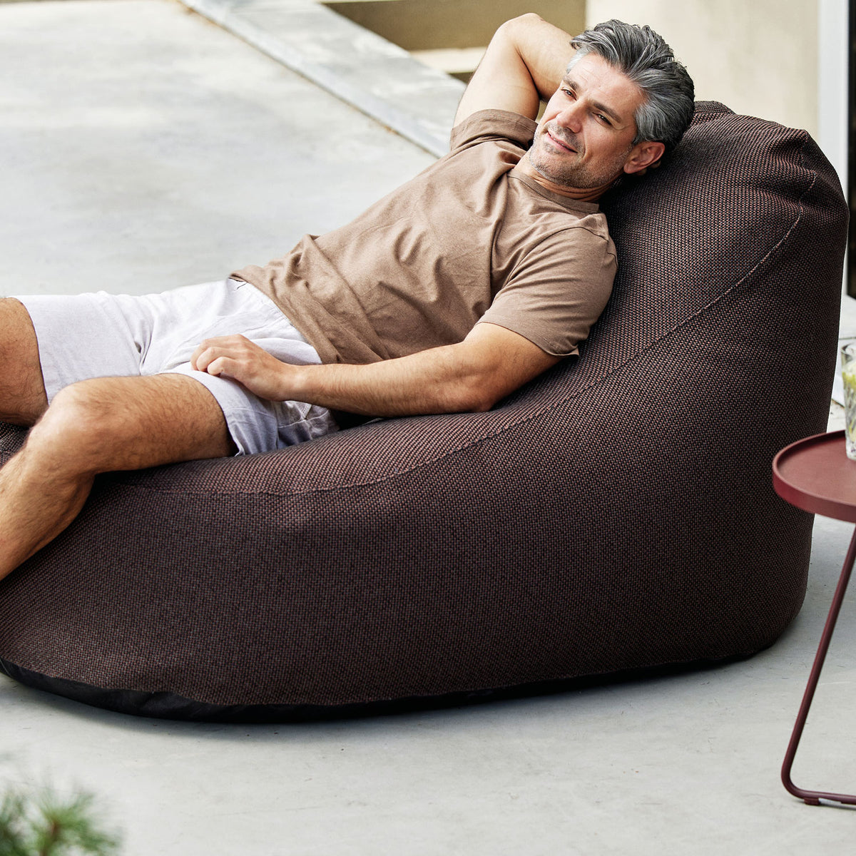 Cozy Bean Bag Chair by Cane-Line, showing cozy bean bag chair in live shot.