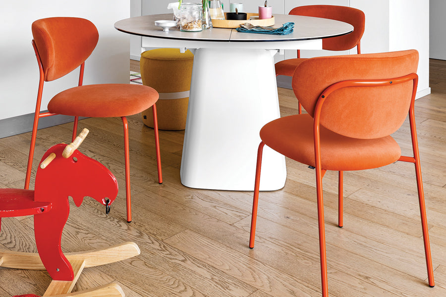 Cozy Chair by Connubia, showing cozy chairs with table in live shot.