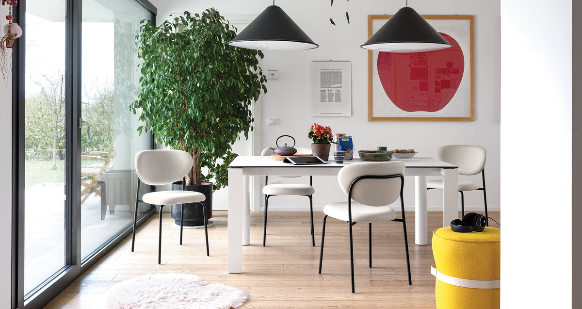 Cozy Chair by Connubia, showing cozy chairs with table in live shot.