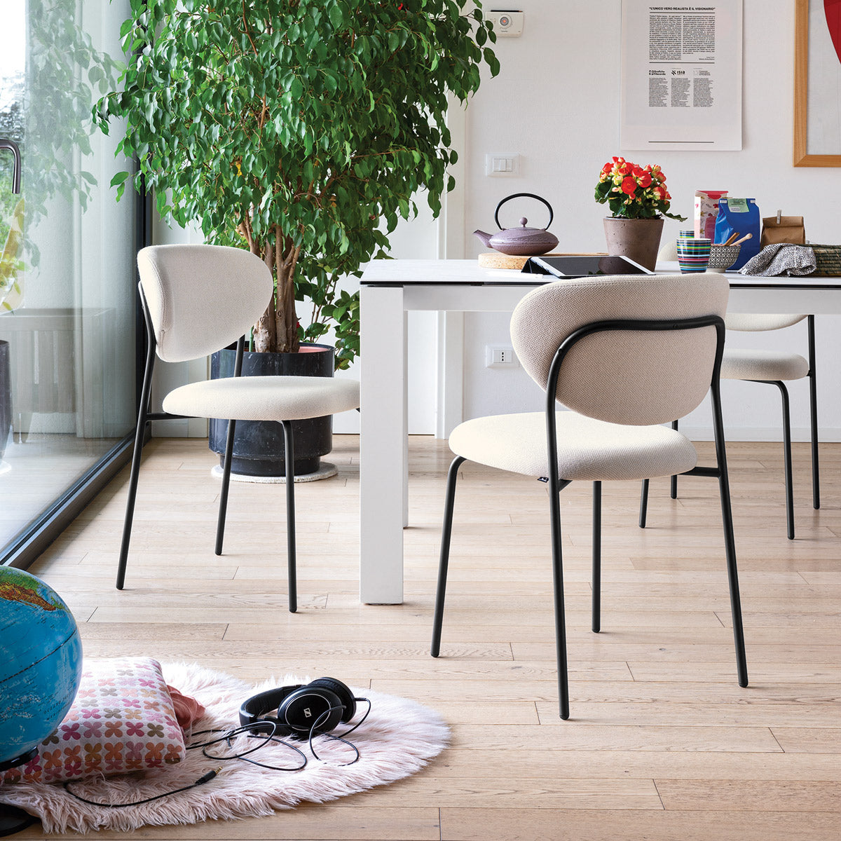Cozy Chair by Connubia, showing cozy chairs with table in live shot.