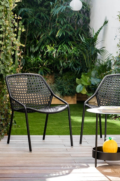 Croisette Armchair by Fermob, showing armchairs in live shot.