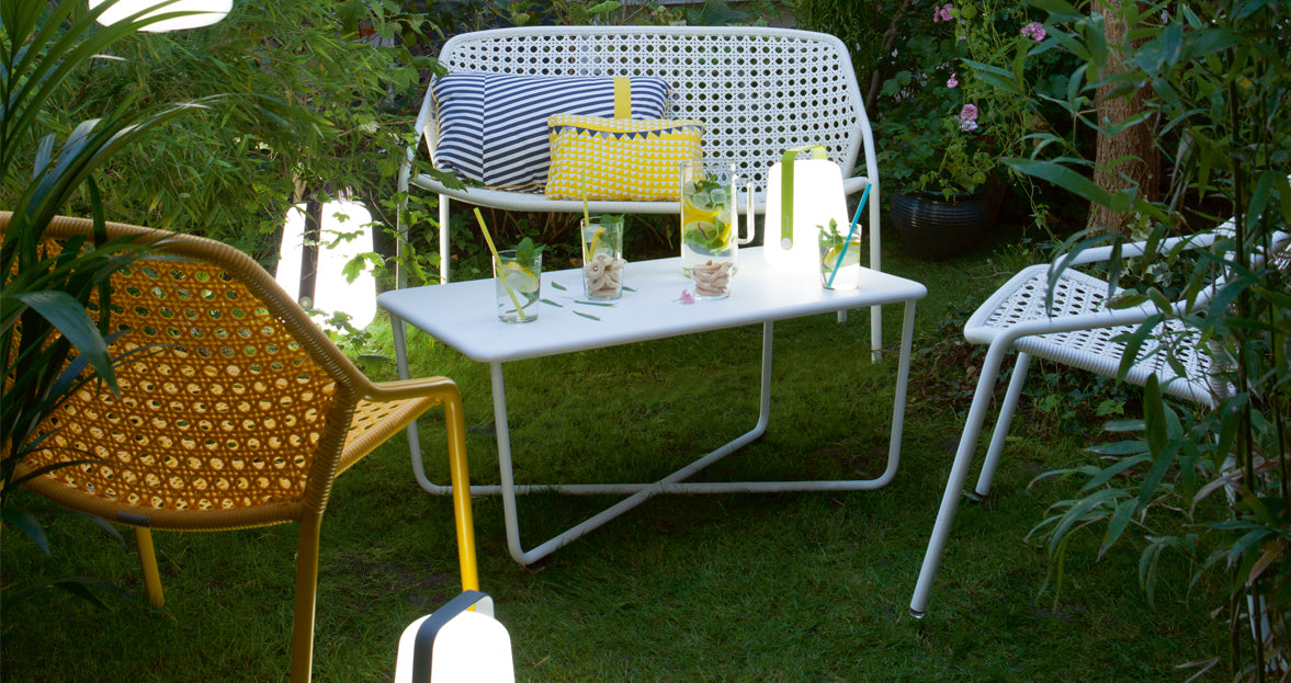 Croisette Low Table by Fermob, showing front view of low table with chair in the live shot.