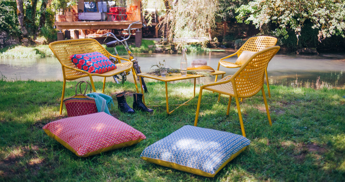Croisette Low Table by Fermob, showing low table with chair in the live shot.