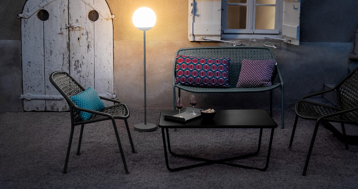 Croisette Low Table by Fermob, showing front view of low table with chair in the live shot.