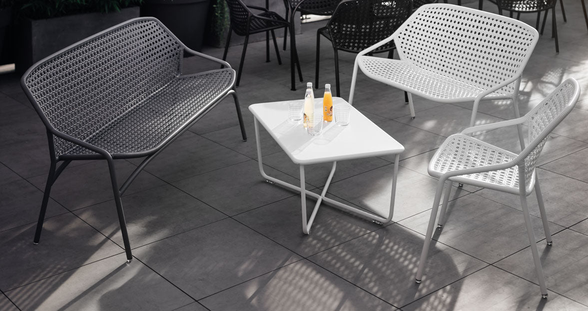 Croisette Low Table by Fermob, showing top view of low table with chair in the live shot.