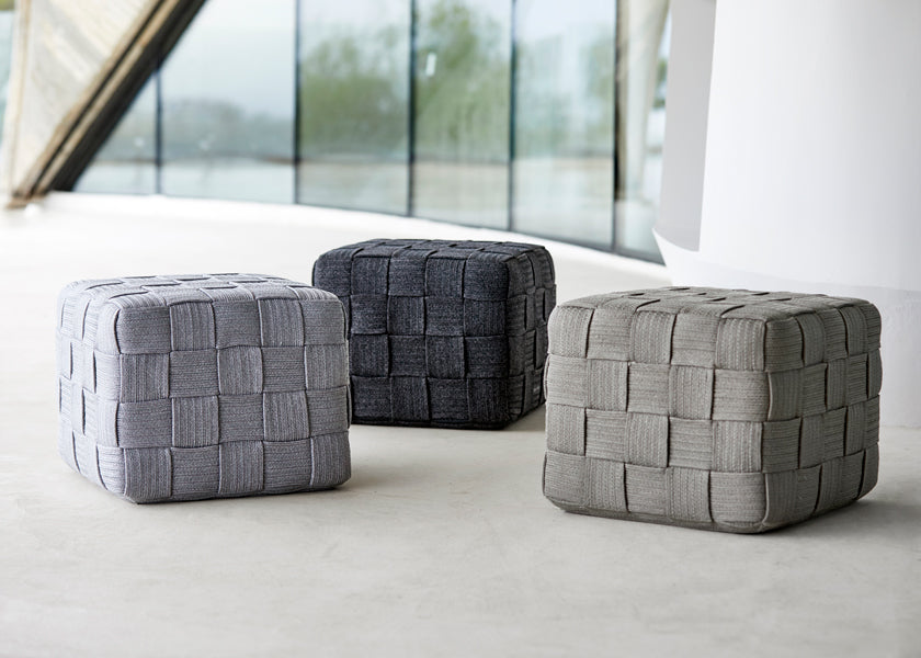 Cube Footstool by Cane-Line, showing cube footstools in live shot.