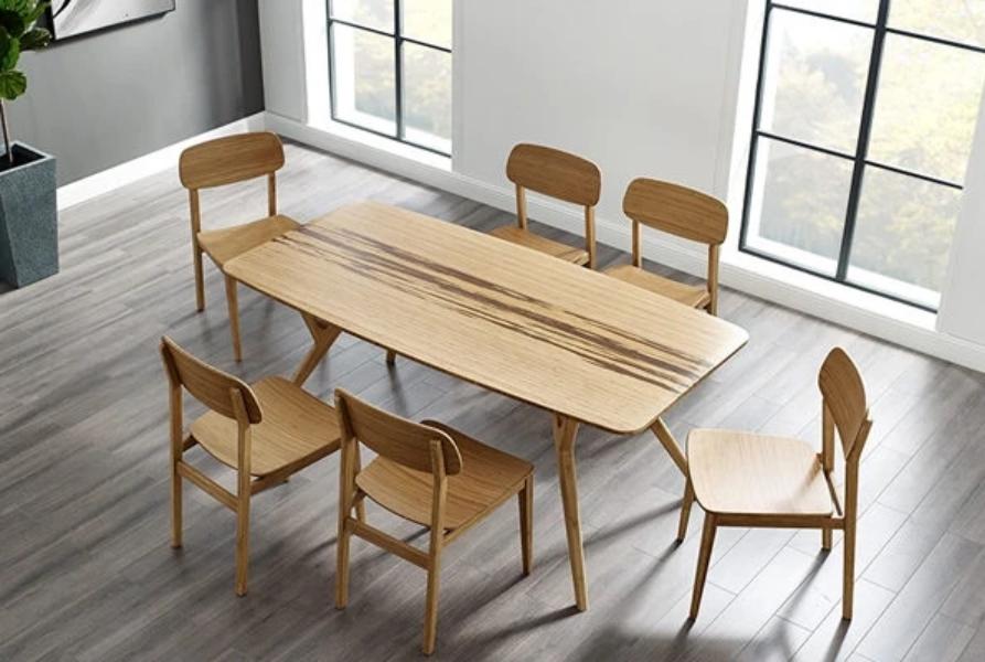 Currant Dining Chair by Greenington, showing currant chairs with table in live shot.