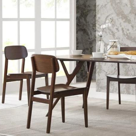 Currant Dining Chair by Greenington, showing currant chairs with table in live shot.