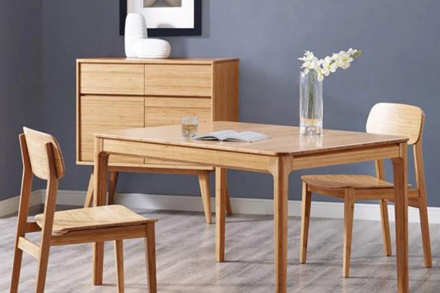 Currant Dining Chair by Greenington, showing currant chairs with table in live shot.