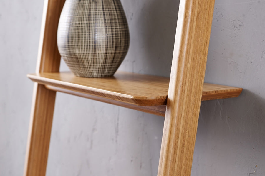 Currant Leaning Bookshelf by Greenington, showing closeup view of currant leaning bookshelf in live shot.