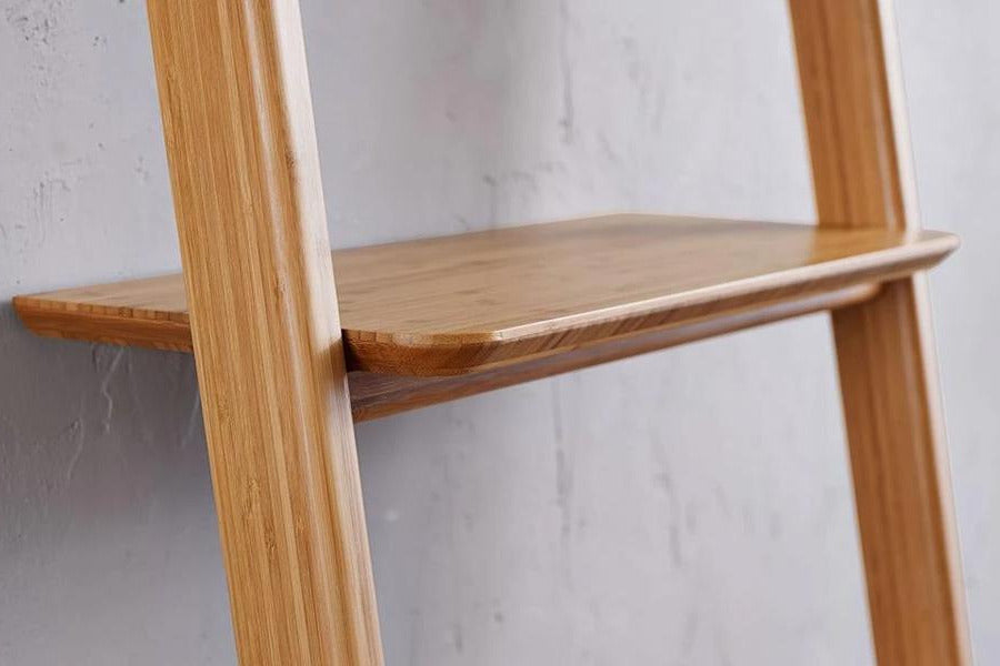 Currant Leaning Bookshelf by Greenington, showing closeup view of currant leaning bookshelf in live shot.