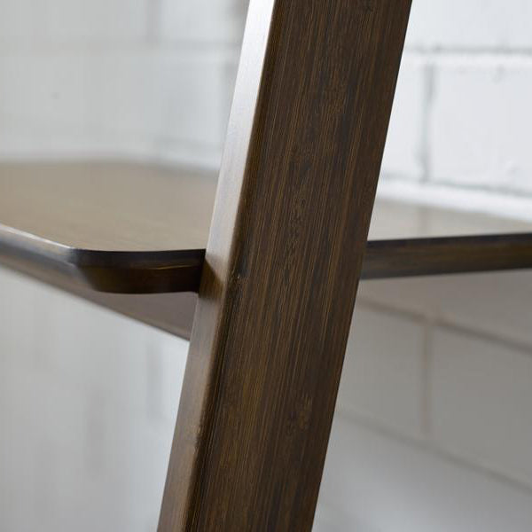 Currant Leaning Bookshelf by Greenington, showing closeup view of currant leaning bookshelf in live shot.