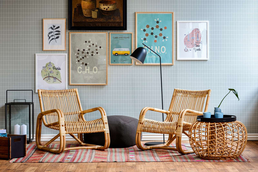 Curve Indoor Lounge Chair by Cane-Line, showing curve indoor lounge chairs with table in live shot.