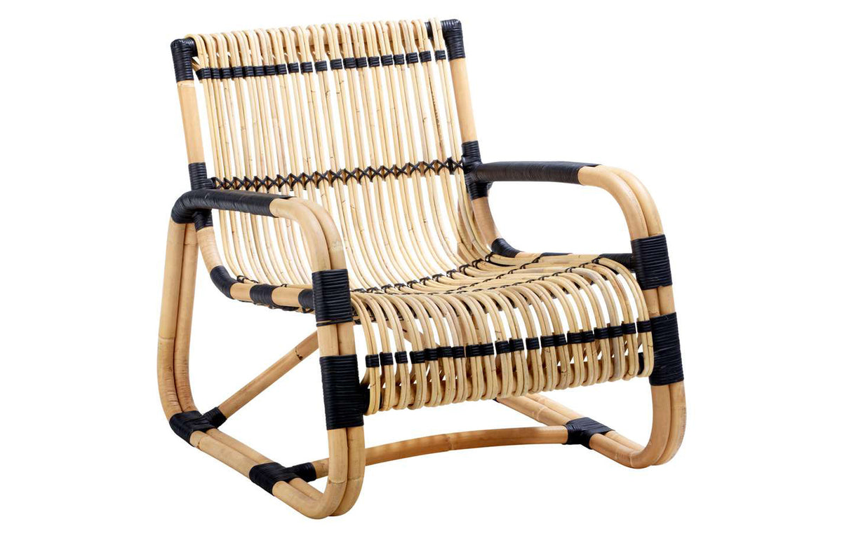 Curve Indoor Lounge Chair by Cane-Line - Natural Rattan/Black Bindings.