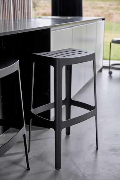 Cut High Bar Stool by Cane-Line , showing cut high bar stools in live shot.