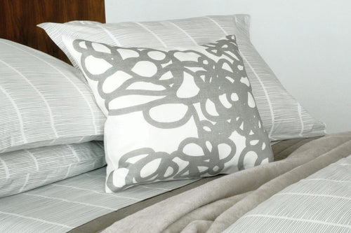 Daisy Printed Linen Pillow by Area, shown in grey.