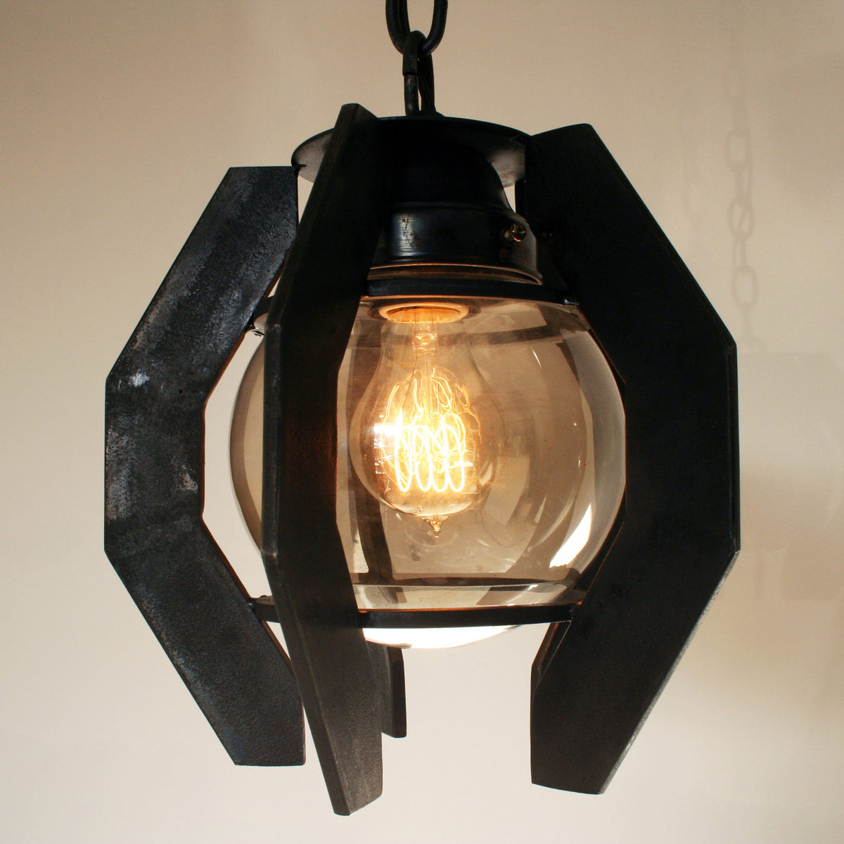 James De Wulf Ball Pendant by De Wulf, shown in forge blackened steel.