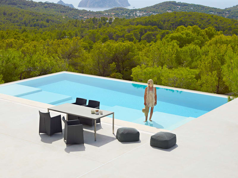 Diamond Outdoor Dining Armchair by Cane-Line, showing diamond outdoor dining armchairs in live shot.
