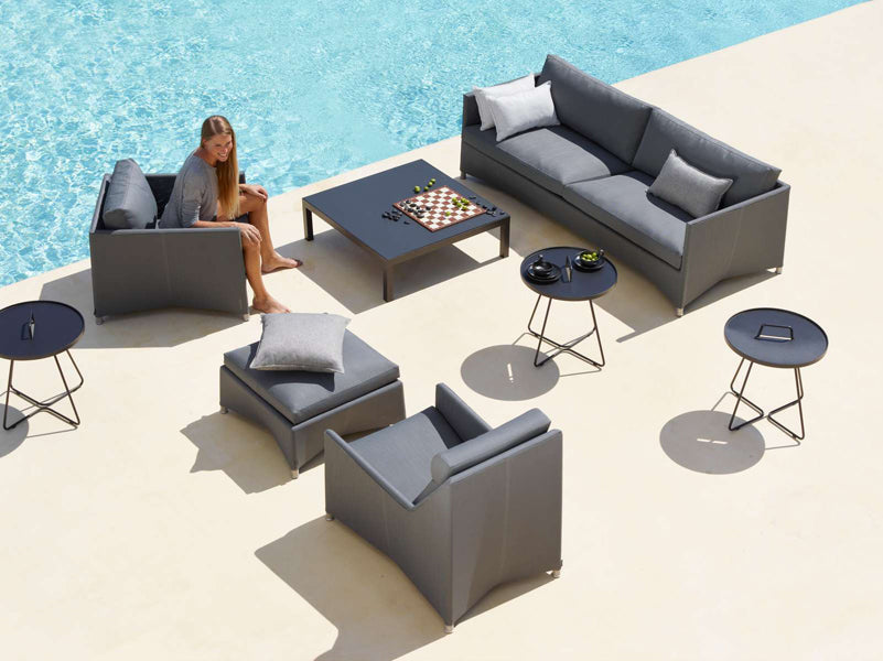 Diamond Outdoor Footstool by Cane-Line, showing diamond outdoor footstool in live shot.