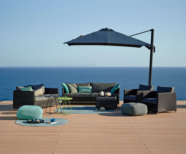Diamond Outdoor Footstool by Cane-Line, showing diamond outdoor footstool in live shot.
