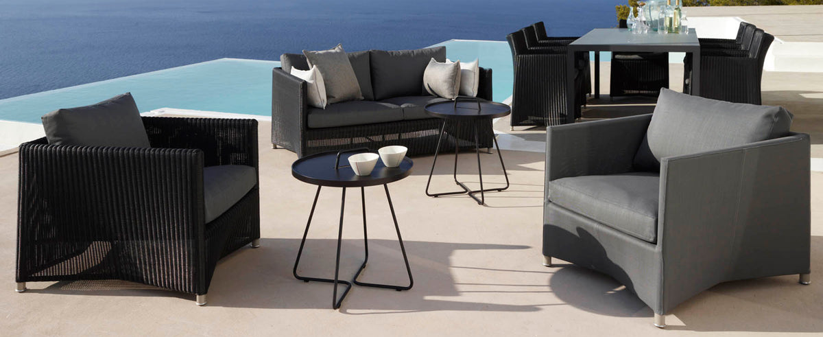 Diamond Outdoor Lounge Chair by Cane-Line, showing diamond outdoor lounge chairs in live shot.