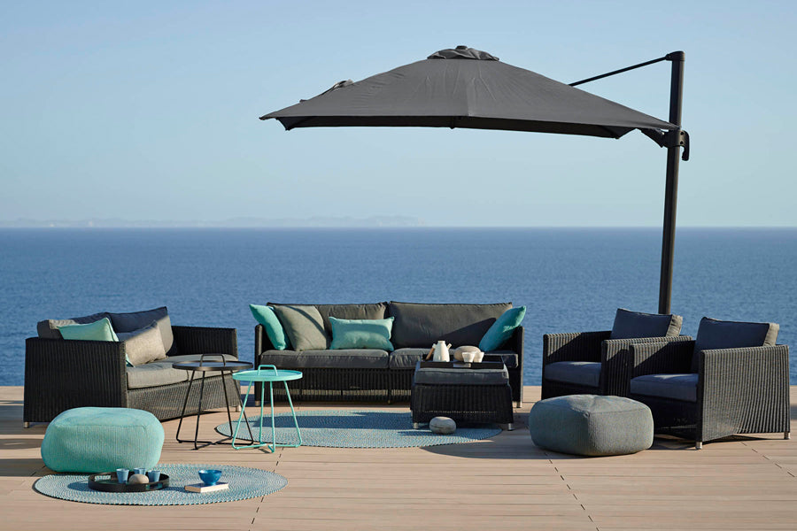 Diamond Outdoor Lounge Chair by Cane-Line, showing diamond outdoor lounge chairs in live shot.
