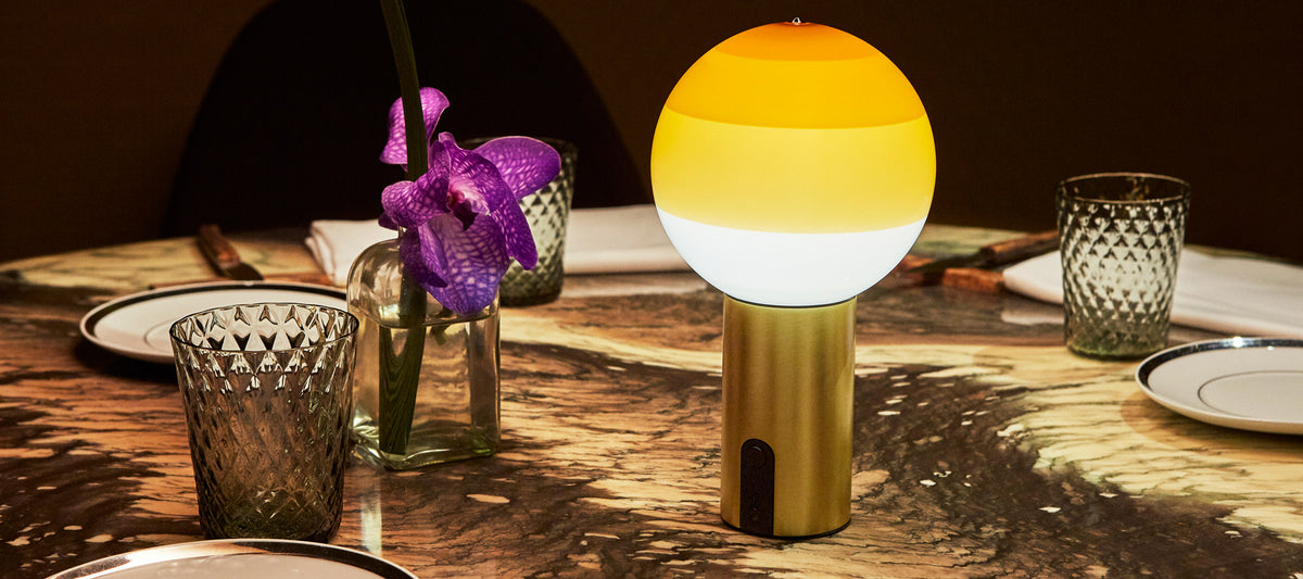 Dipping Portable Lamp by Marset, showing dipping portable lamp in live shot.