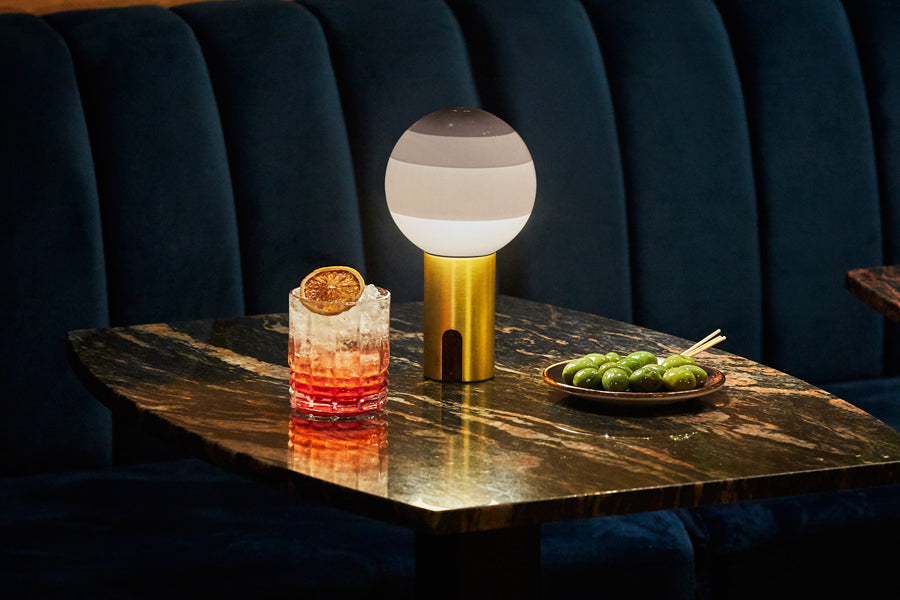 Dipping Portable Lamp by Marset, showing dipping portable lamp in live shot.