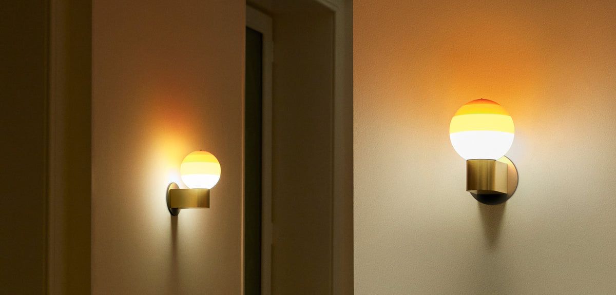 Dipping Wall Lamp by Marset, showing dipping wall lamps in live shot.