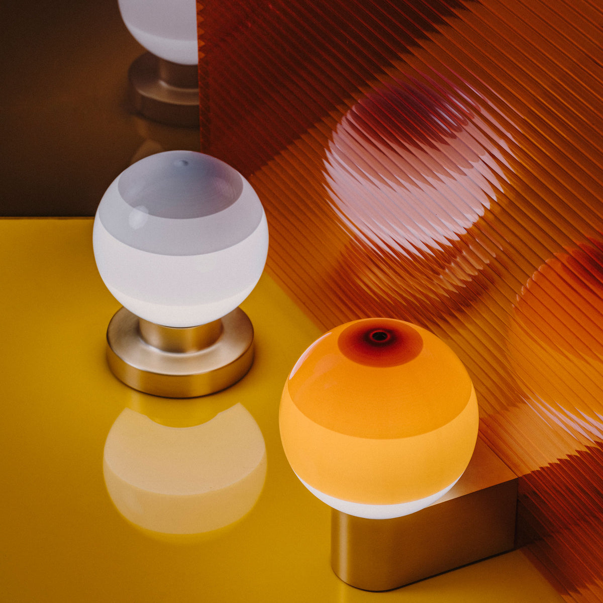 Dipping Wall Lamp by Marset, showing dipping wall lamps in live shot.