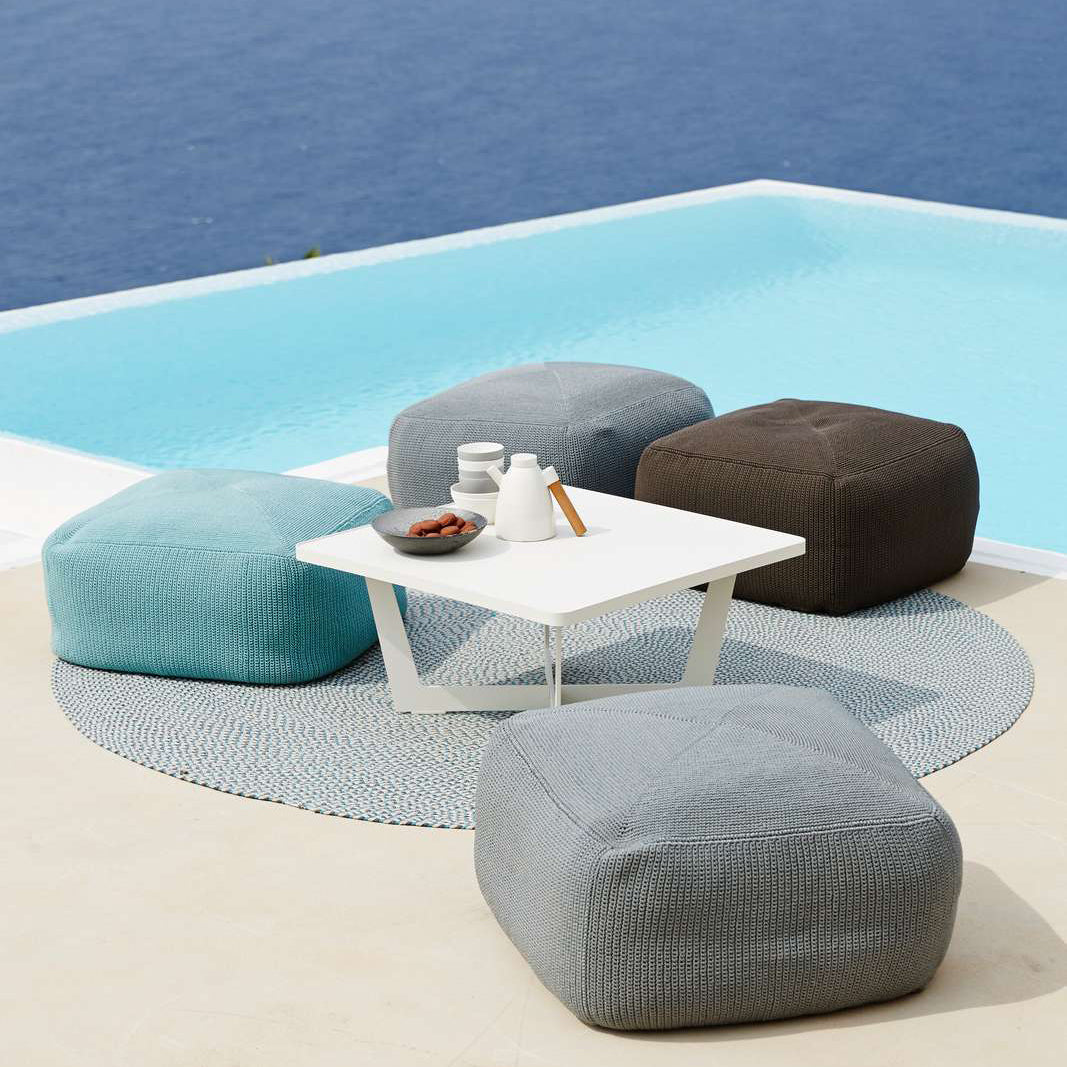 Divine Footstool by Cane-Line, showing divine footstools in live shot.