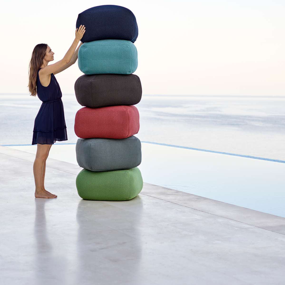 Divine Footstool by Cane-Line, showing divine footstools in live shot.