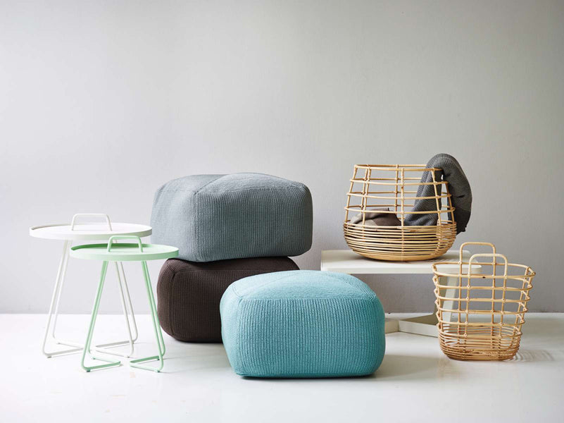 Divine Footstool by Cane-Line, showing divine footstools in live shot.