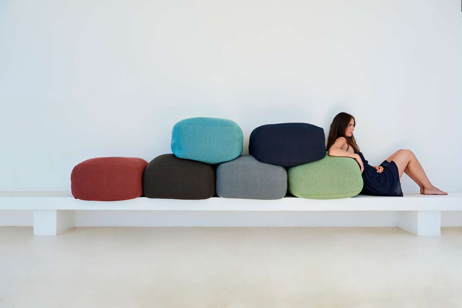 Divine Footstool by Cane-Line, showing divine footstools in live shot.