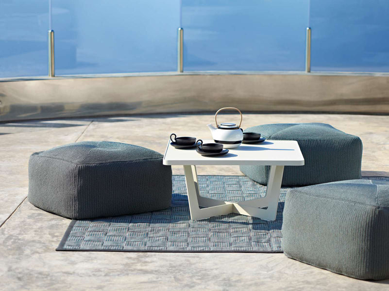 Divine Footstool by Cane-Line, showing divine footstools in live shot.