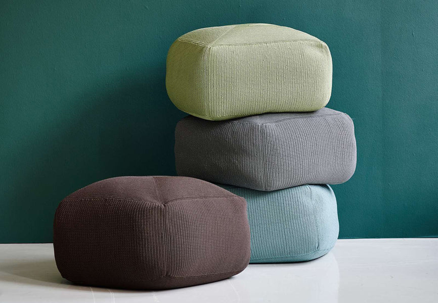 Divine Footstool by Cane-Line, showing divine footstools in live shot.