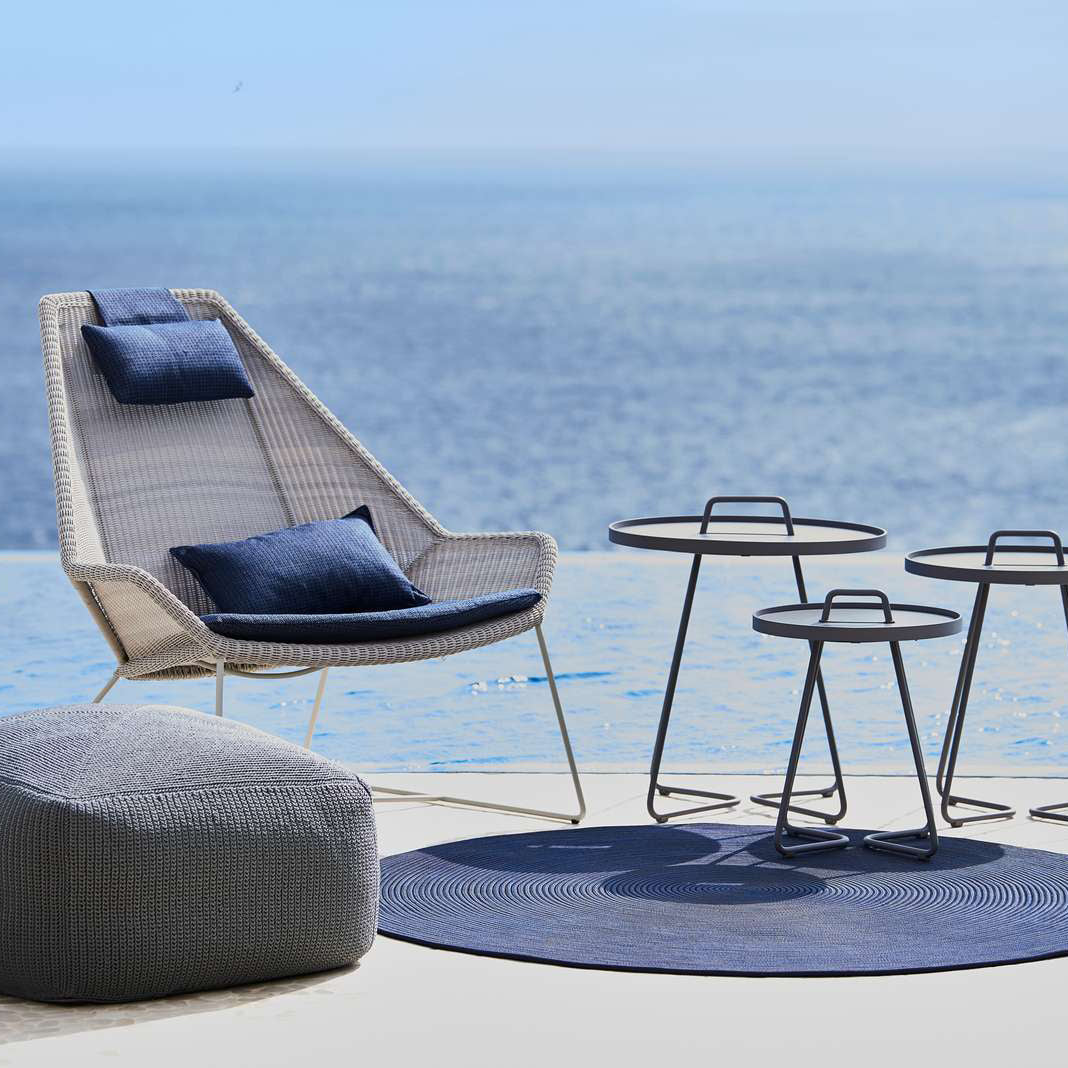 Divine Scatter Cushion by Cane-Line, showing divine scatter cushion in live shot.