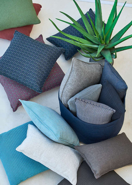 Divine Scatter Cushion by Cane-Line, showing divine scatter cushions in live shot.