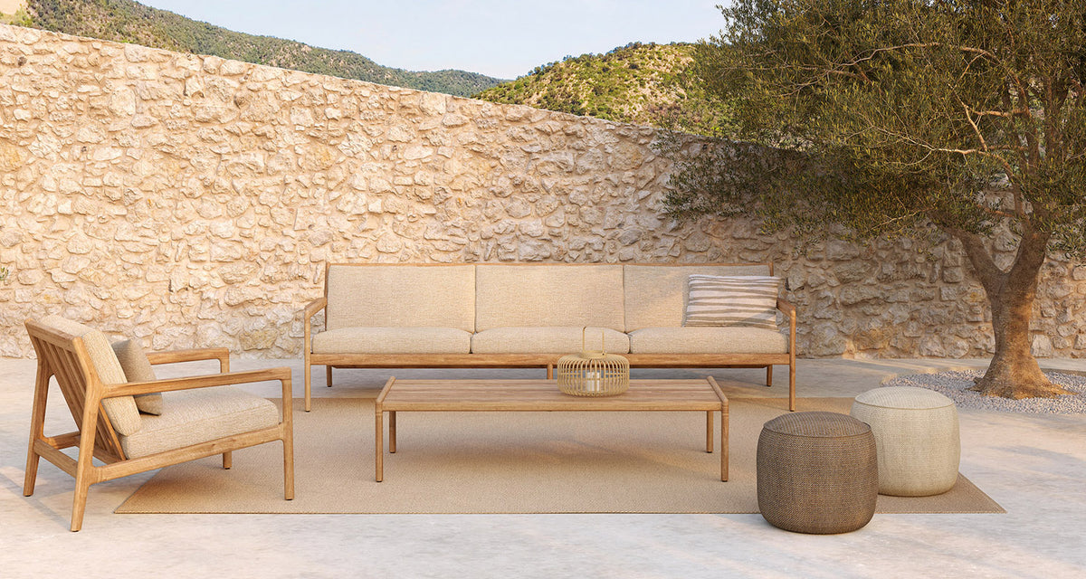 Donut Outdoor Pouf by Ethnicraft, showing donut outdoor pouf in live shot.