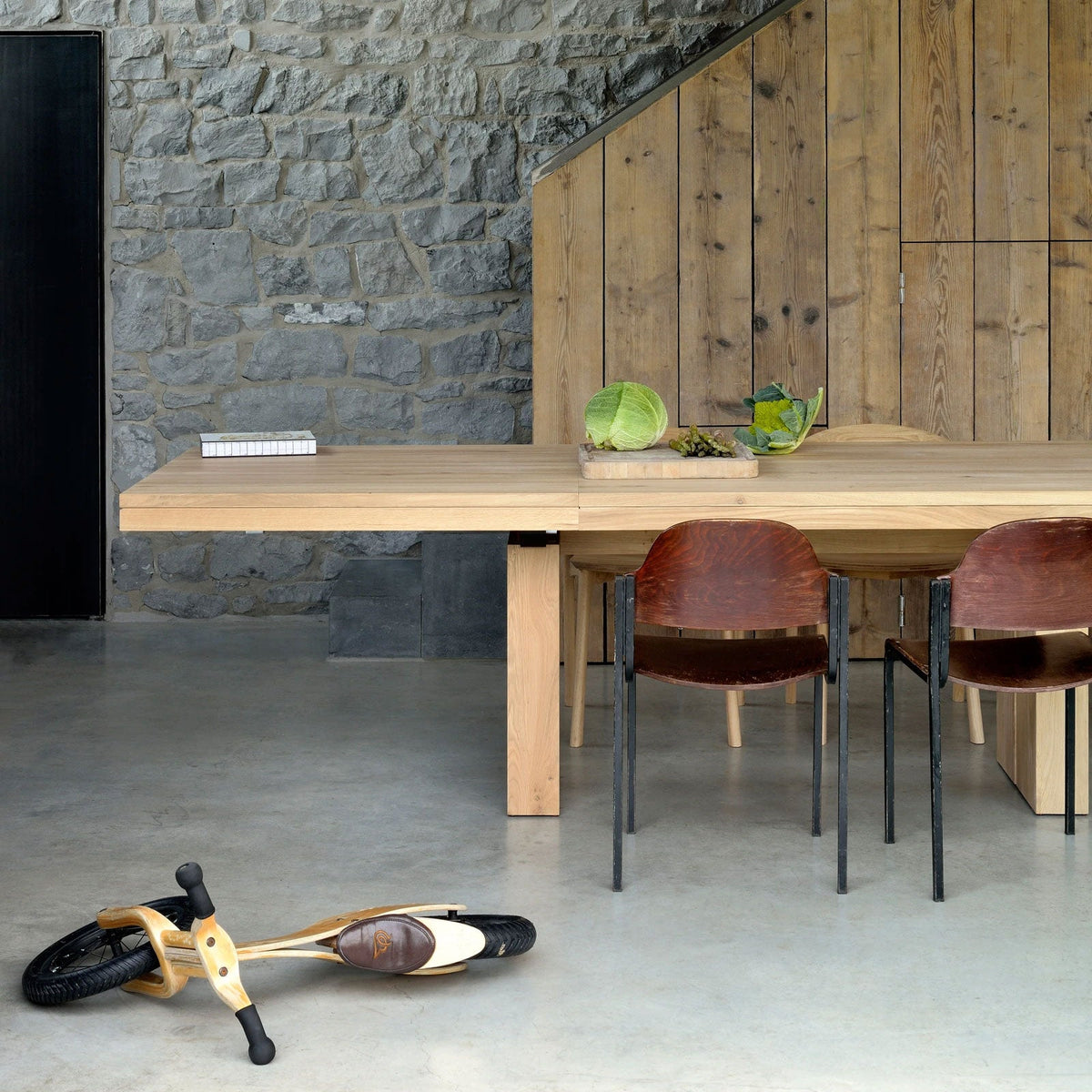 Double Extendable Dining Table by Ethnicraft, showing double extendable dining table in live shot.