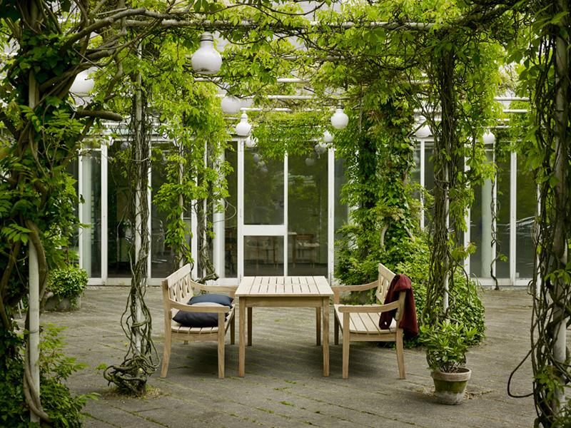 Drachmann Rectangle Teak Table by Skagerak, showing rectangle teak table with benches in live shot.