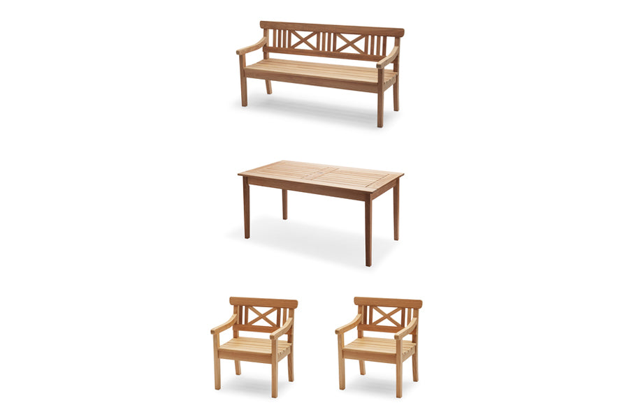 Drachmann Rectangle Teak Table by Skagerak, showing angle view of 61" rectangle teak table with bench & chairs in teak.