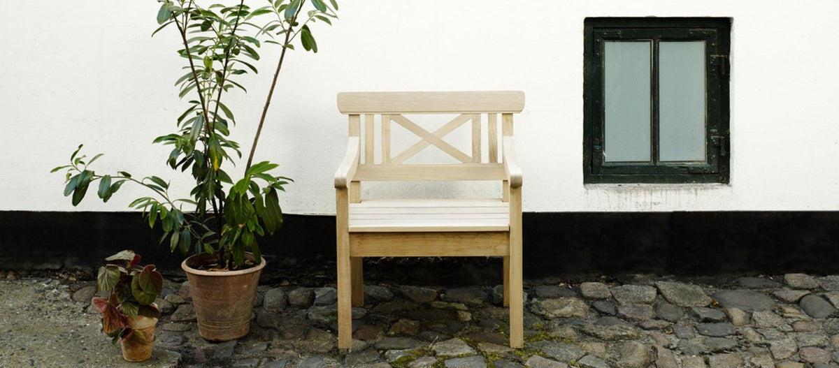 Drachmann Teak Chair by Skagerak, showing drachmann teak chair in live shot.