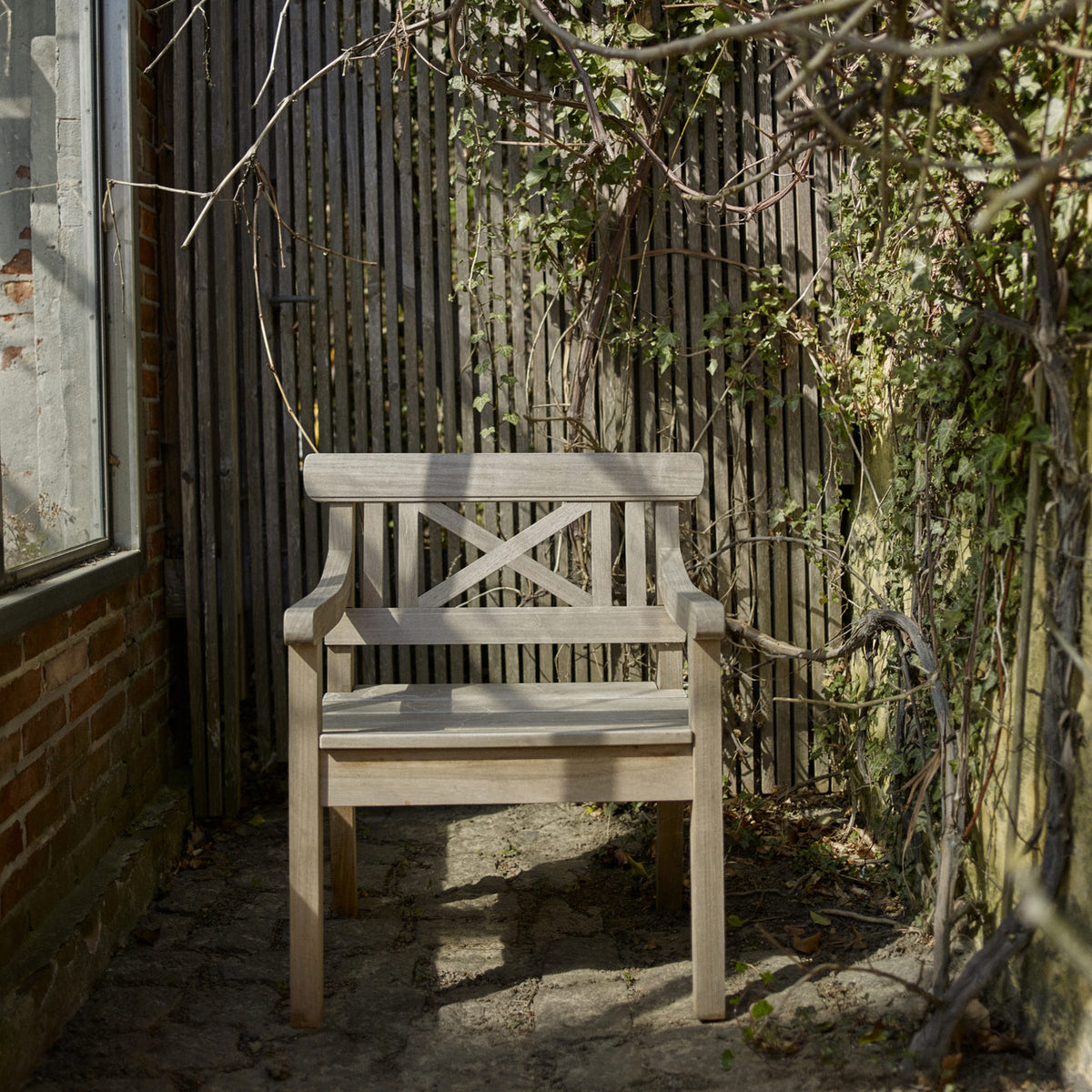 Drachmann Teak Chair by Skagerak, showing drachmann teak chair in live shot.